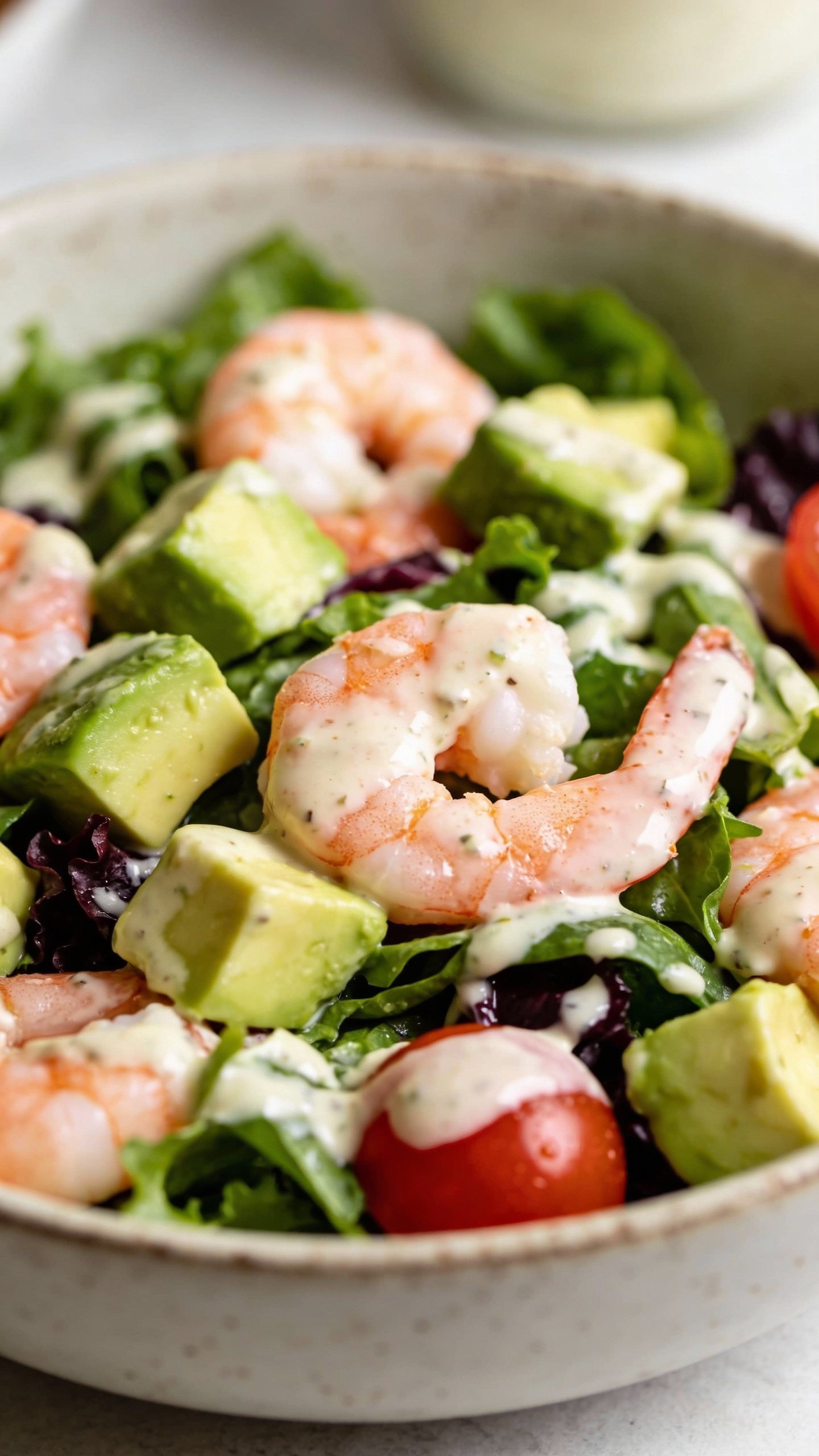 closeup bowl of creamy avocado shrimp keto salad