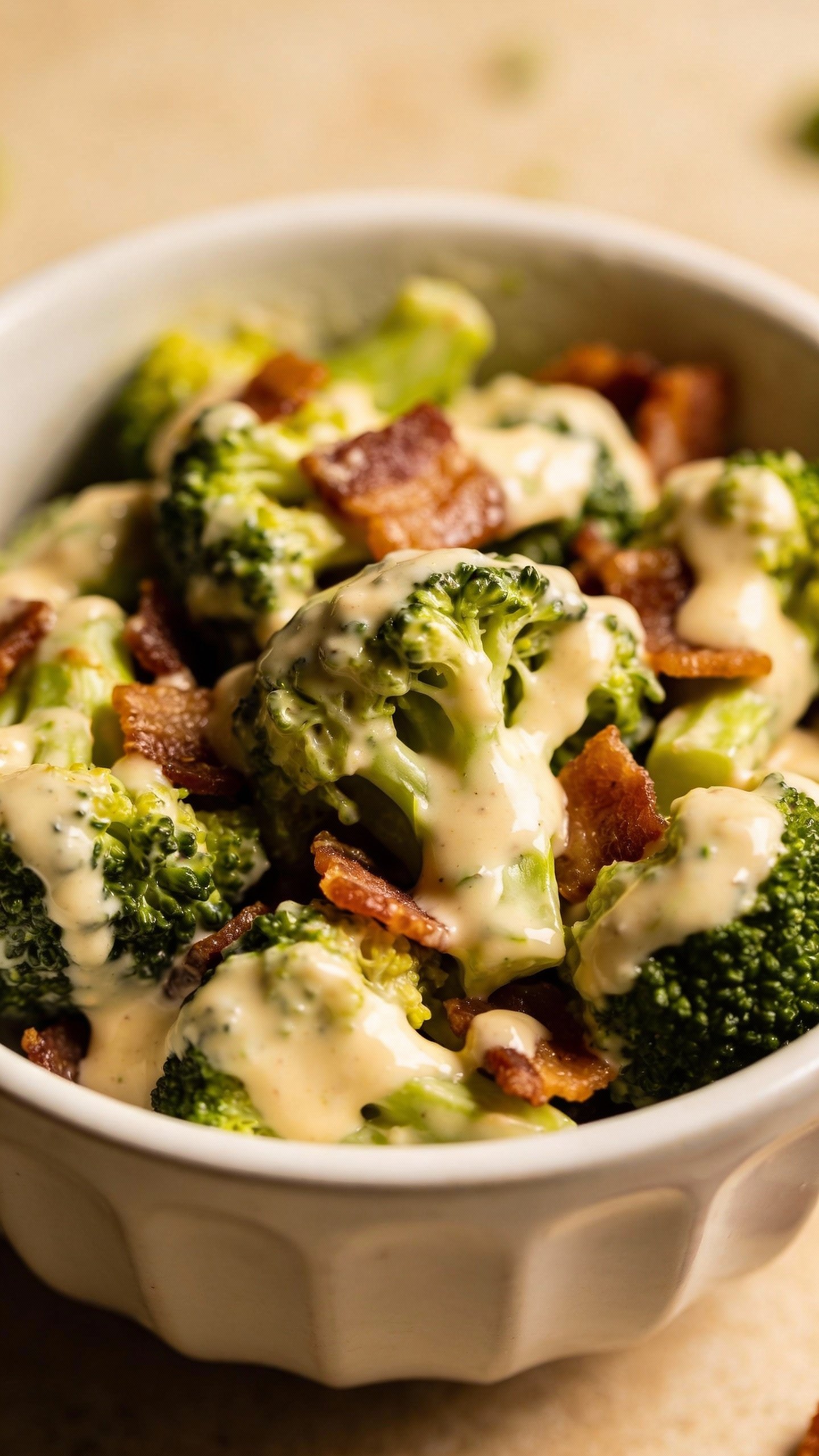 closeup bowl of keto broccoli bacon salad, creamy dressing