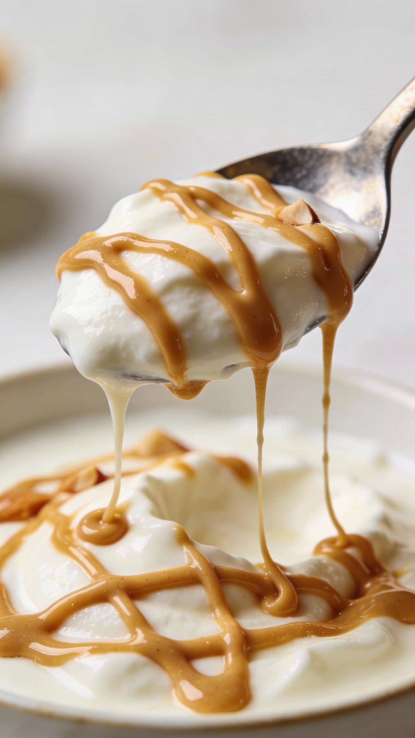 spoonful of Greek yogurt drizzled with almond butter