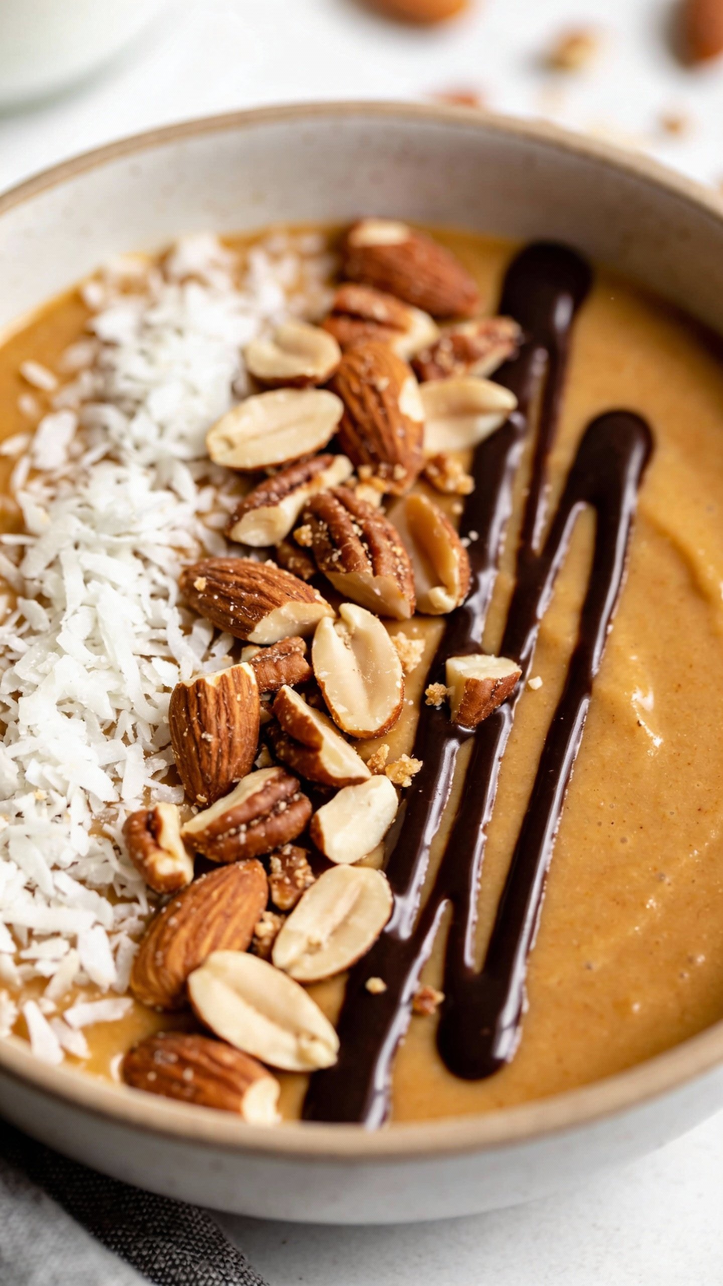 closeup keto almond joy smoothie bowl with toasted almonds