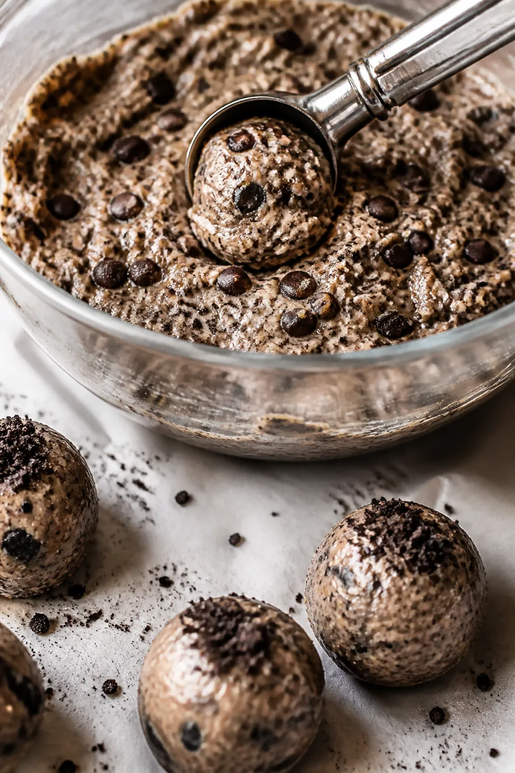 Cooking process, close-up detail: A chilled mixing bowl filled with thick, truffle-like Oreo protein