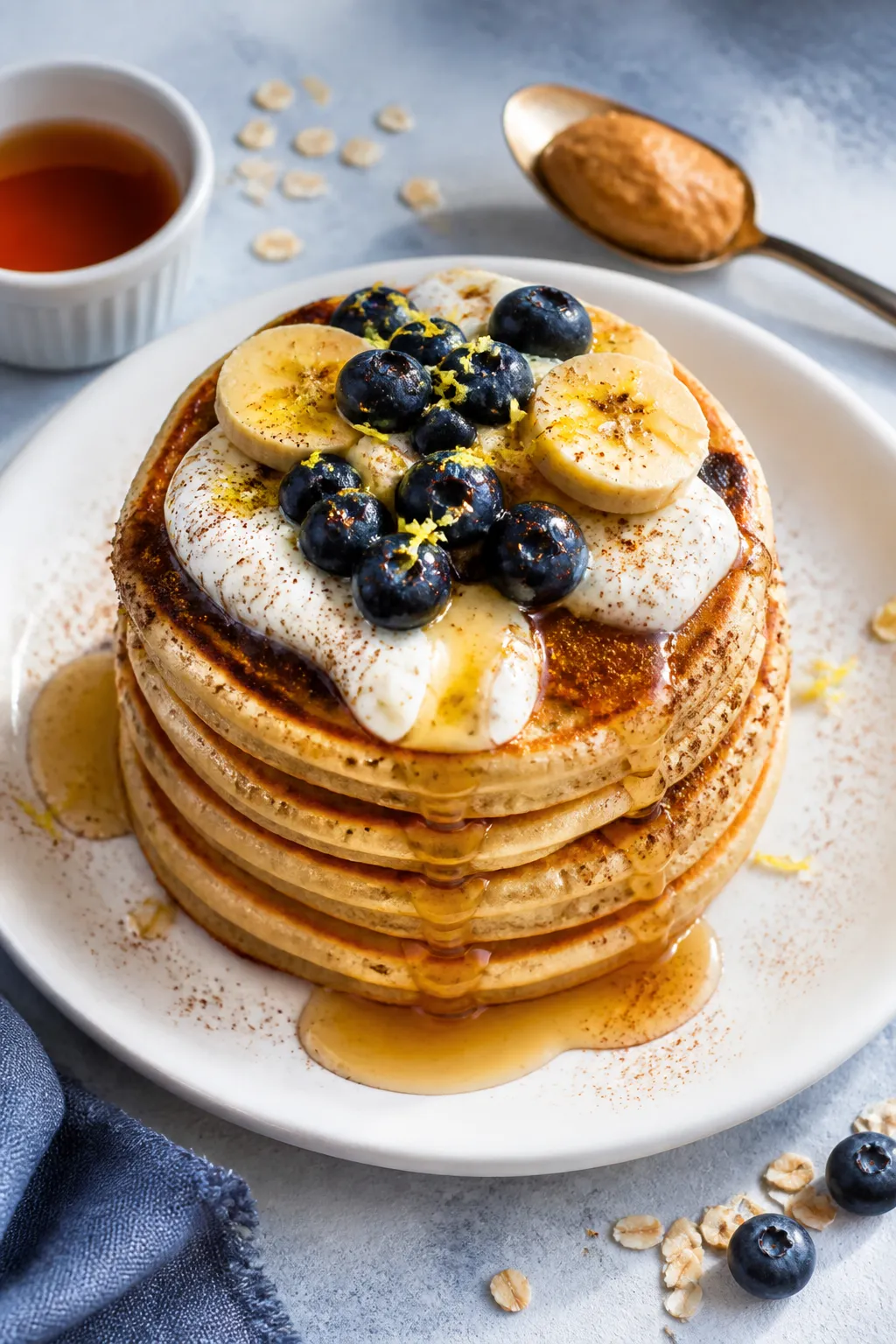 Final dish, tasty top view: Overhead shot of a tall stack of golden cottage cheese protein pancakes 