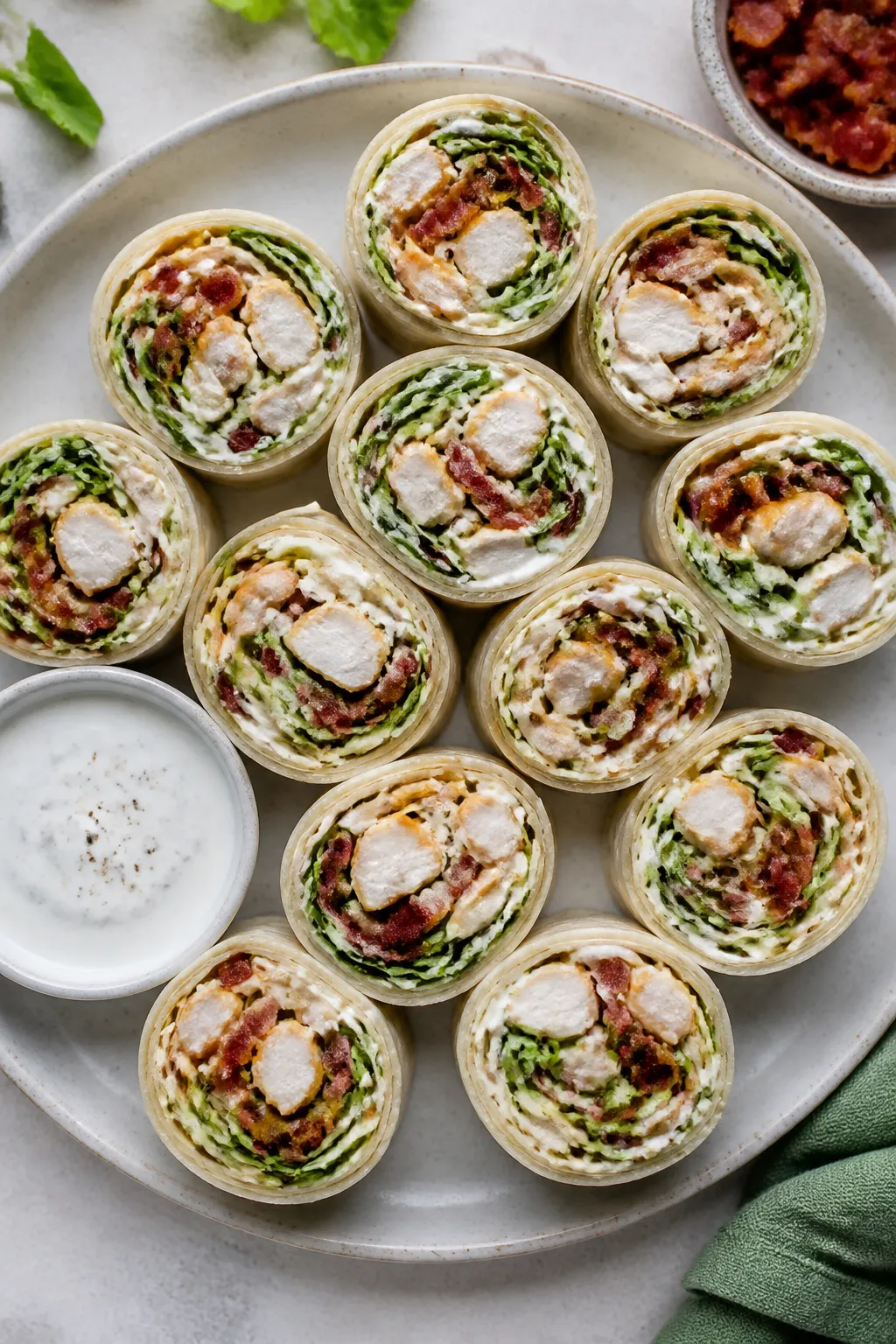 Overhead shot of chilled Chicken Bacon Ranch Wrap Bites sliced into neat 1–