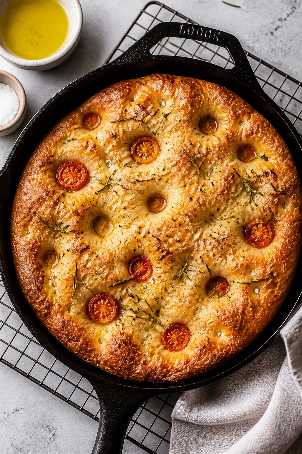 Overhead shot of freshly baked Cottage Cheese Focaccia just out of the oven in a well-oiled cast-iro